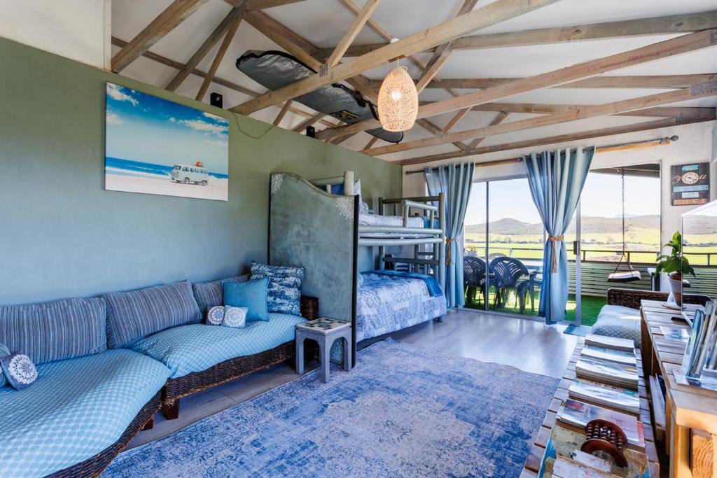 a living room with a couch and a bunk bed at Reebok Rest in Reebok