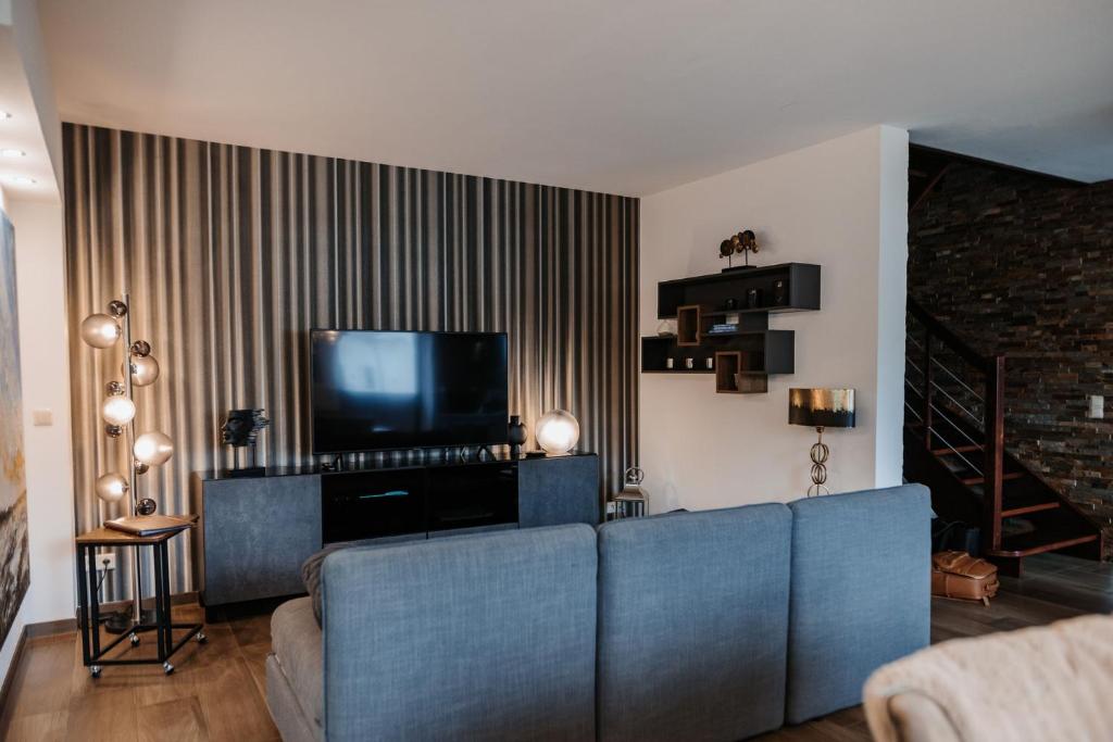 TV a/nebo společenská místnost v ubytování Uns Langhus
