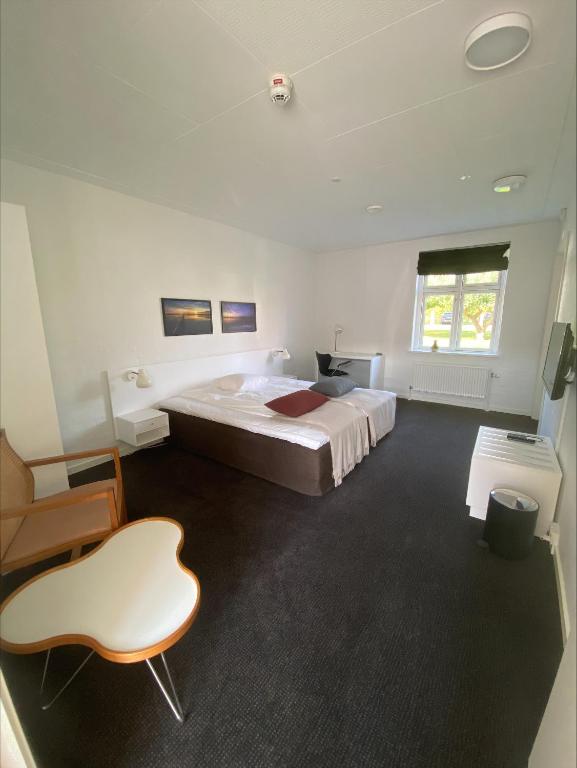 Postel nebo postele na pokoji v ubytování Borre Knob Fjordhotel