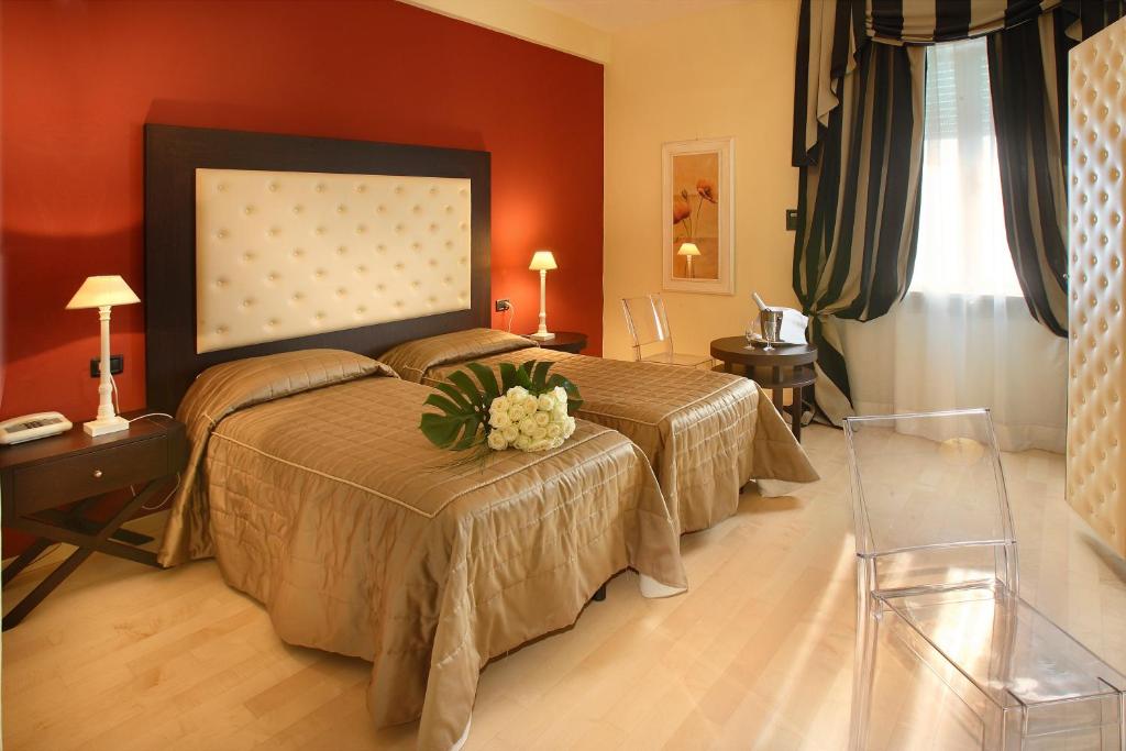 Postel nebo postele na pokoji v ubytování Hotel Manzoni Wellness&Spa
