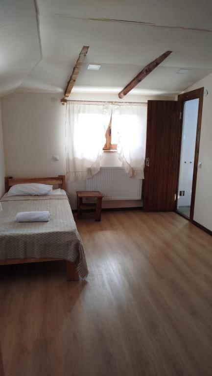 Postel nebo postele na pokoji v ubytování Gremeli Wine & Hotel