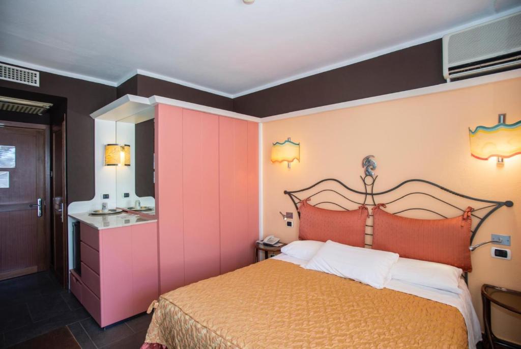Кровать или кровати в номере Hotel Barcarola 2