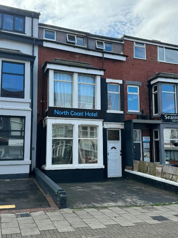 a north coast hospital building on a street at North Coast Hotel in Blackpool