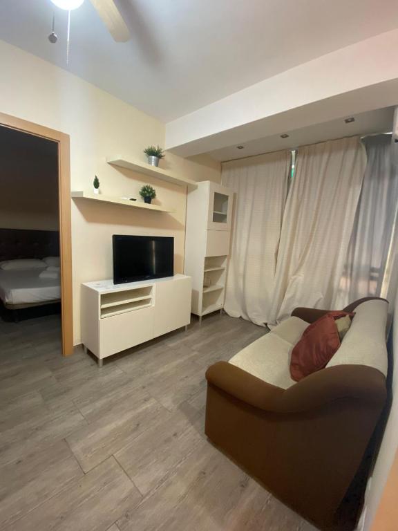 Televízia a/alebo spoločenská miestnosť v ubytovaní Apartamento super luminoso