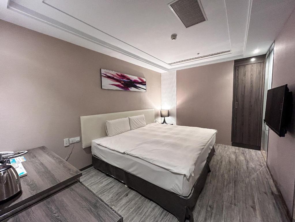 Postel nebo postele na pokoji v ubytování Royal Fine Hotel