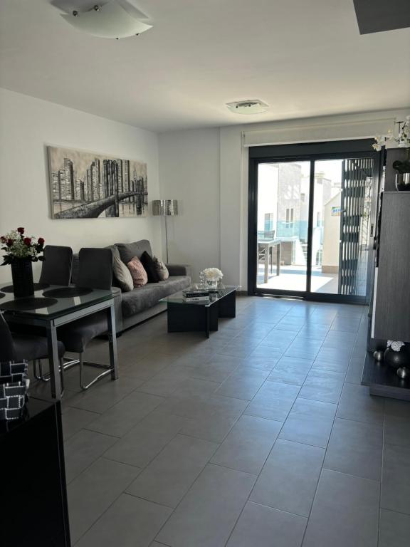 Posezení v ubytování OasisBeach Penthousse la Zénia