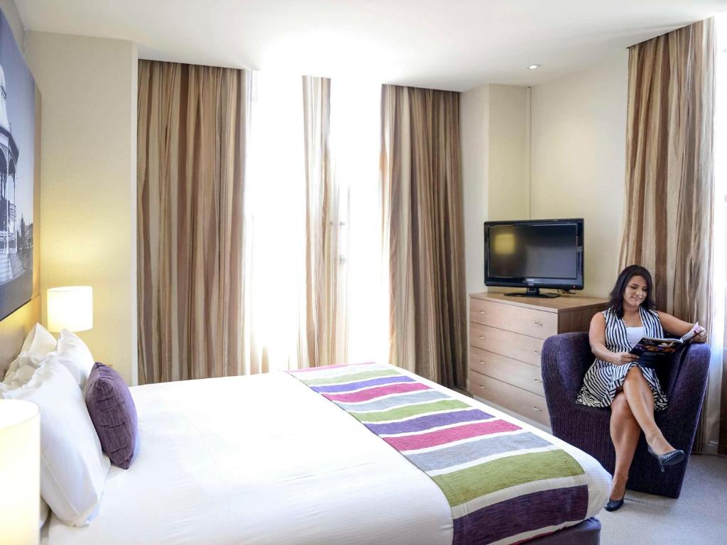 Postel nebo postele na pokoji v ubytování Grosvenor Hotel Adelaide by Accor