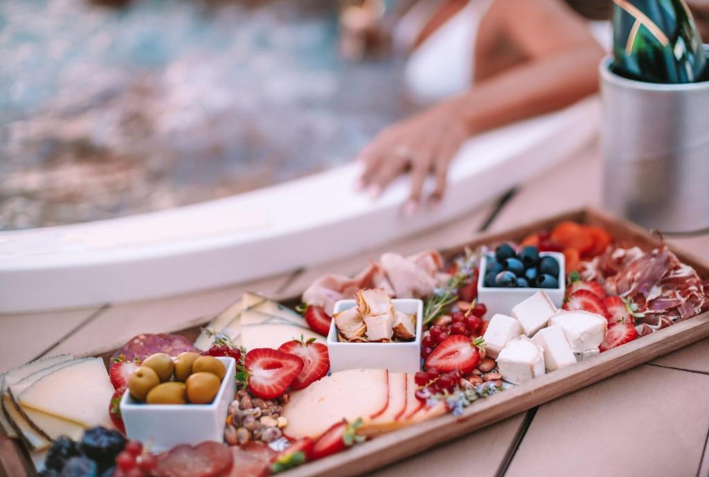 a tray of fruits and vegetables on a table at Hard Rock Hotel Ibiza in Playa d'en Bossa