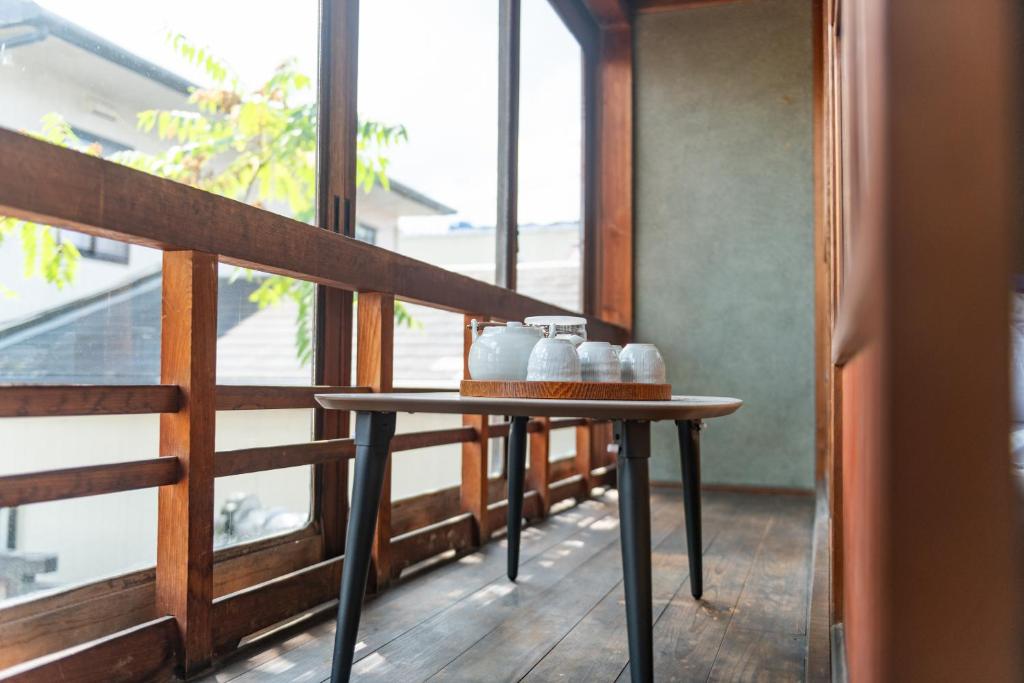 Balkón nebo terasa v ubytování 篠山城下町ゲストハウス quolo