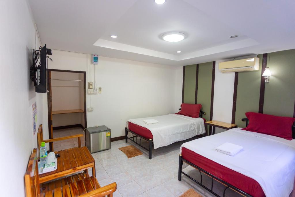 Postel nebo postele na pokoji v ubytování Sakul Plang Resort