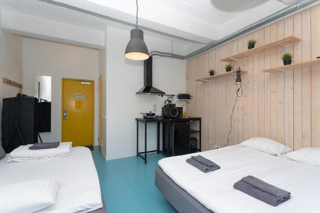 Voodi või voodid majutusasutuse Hektor Design Hostel toas
