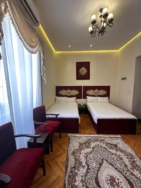 Postel nebo postele na pokoji v ubytování Victoria Cairo Hotel