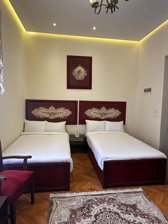 Postel nebo postele na pokoji v ubytování Victoria Cairo Hotel