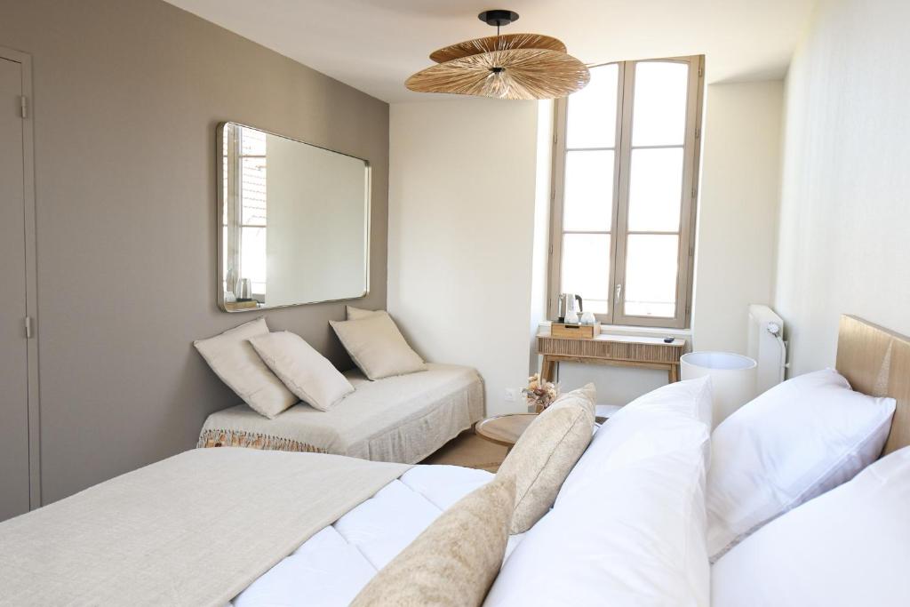 Postel nebo postele na pokoji v ubytování Le Clos des Cadoles