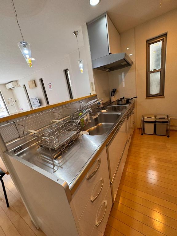 Kuchyň nebo kuchyňský kout v ubytování Comfy House Namba