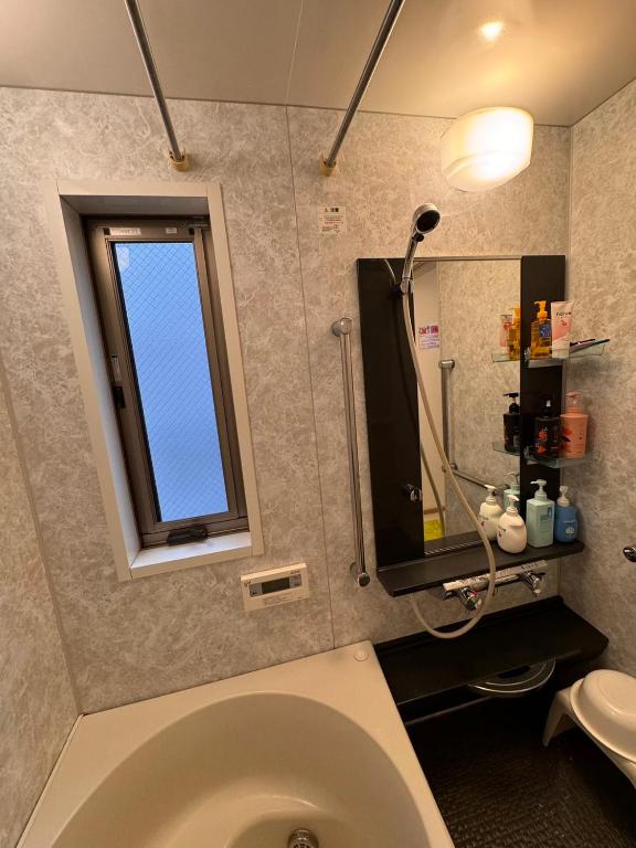 Koupelna v ubytování Comfy House Namba