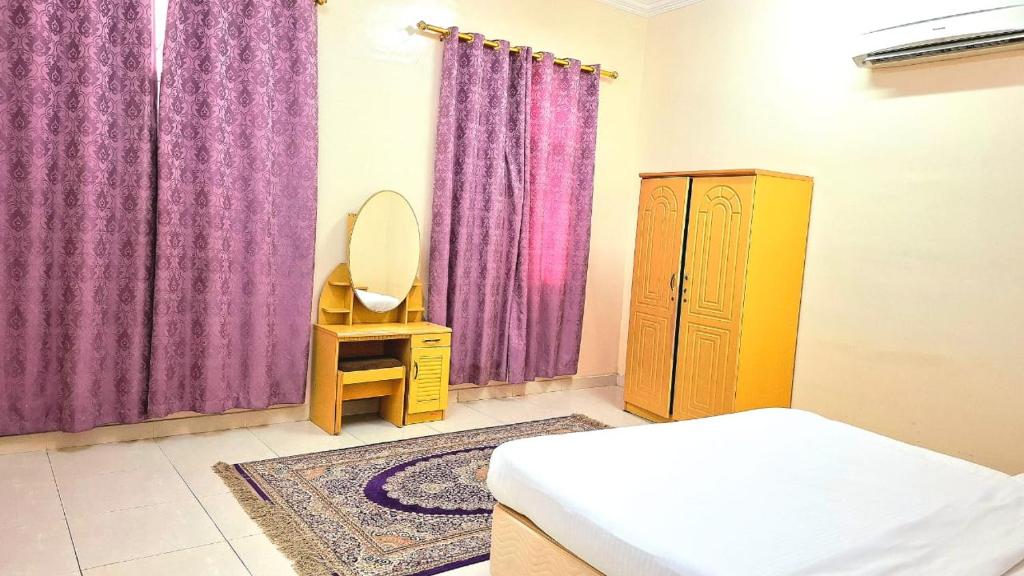 Postel nebo postele na pokoji v ubytování Al Afiah Corniche Hotel Apartment