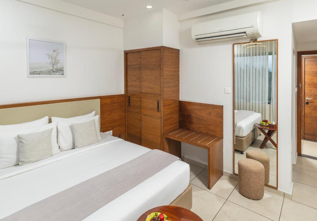 Postel nebo postele na pokoji v ubytování Oshin Hotel