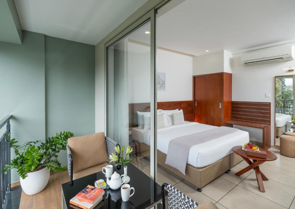 Postel nebo postele na pokoji v ubytování Oshin Hotel