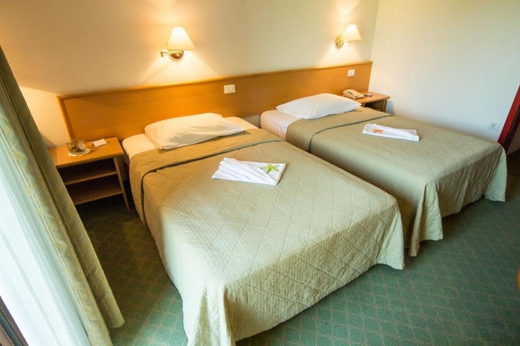 Postel nebo postele na pokoji v ubytování Hotel Vile Park