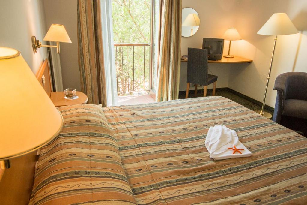 Postel nebo postele na pokoji v ubytování Hotel Vile Park