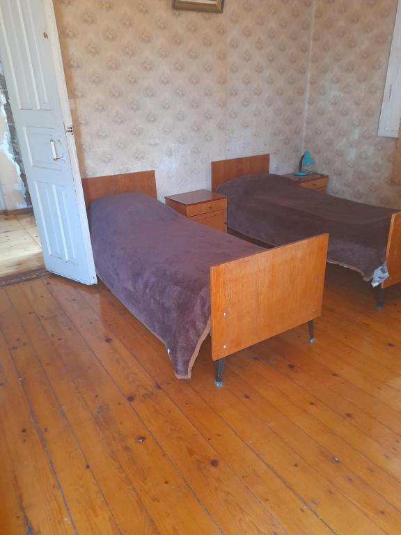 Postel nebo postele na pokoji v ubytování Levani's GuestHouse