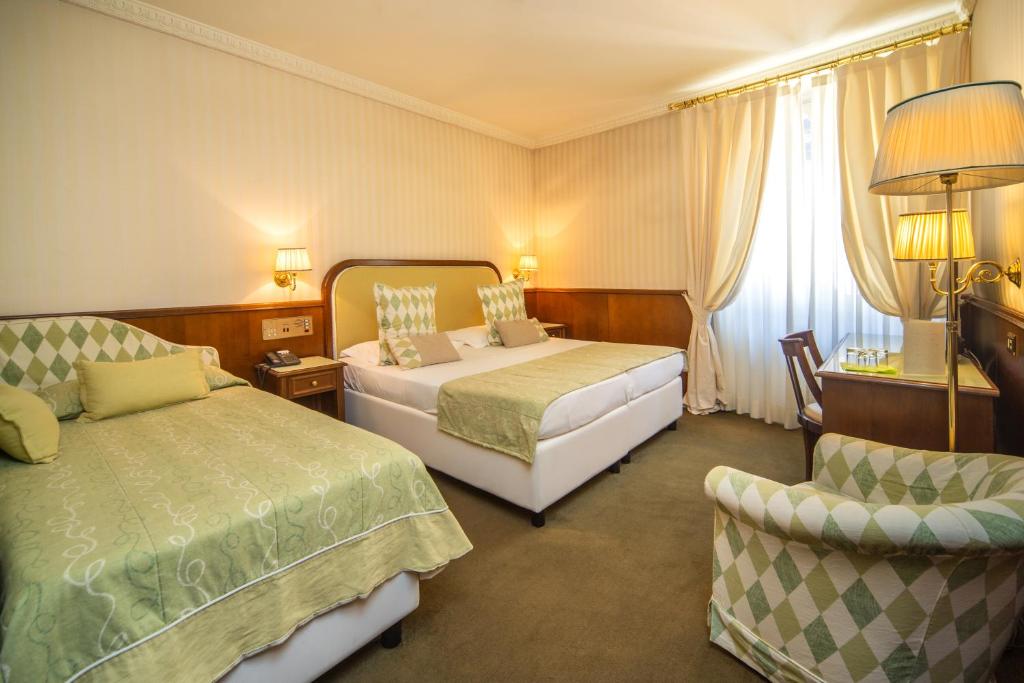 Postel nebo postele na pokoji v ubytování Grand Hotel Bastiani