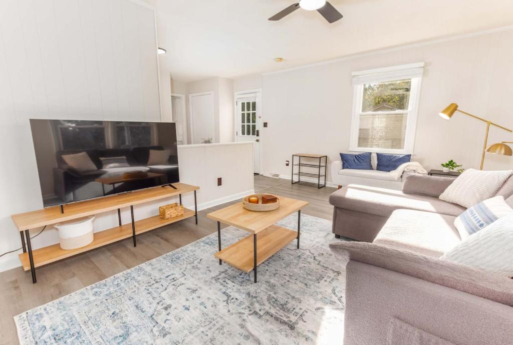a living room with a couch and a table at Comfy and Convenient Duplex in Columbia