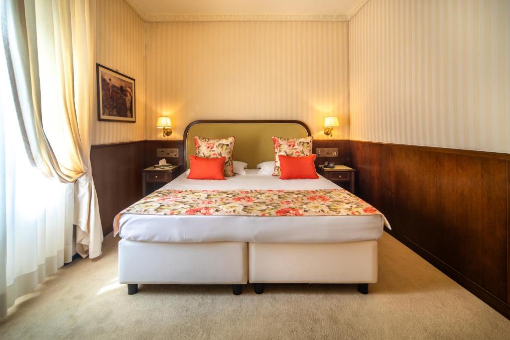 Postel nebo postele na pokoji v ubytování Grand Hotel Bastiani
