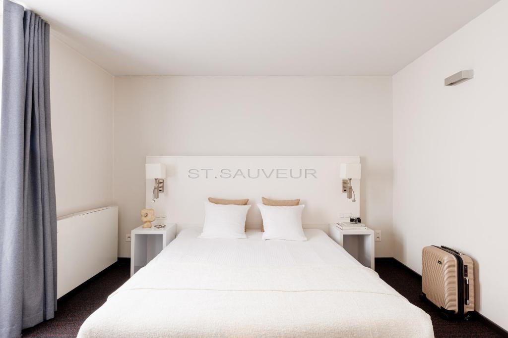 Postel nebo postele na pokoji v ubytování Hotel Saint Sauveur by WP Hotels