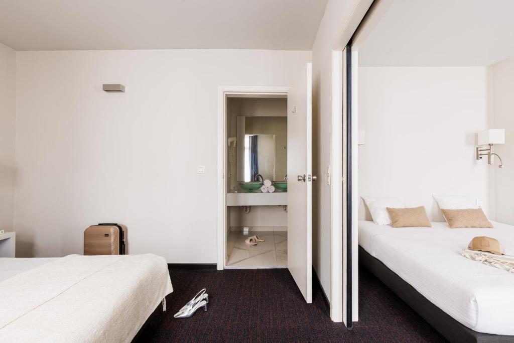 Postel nebo postele na pokoji v ubytování Hotel Saint Sauveur by WP Hotels