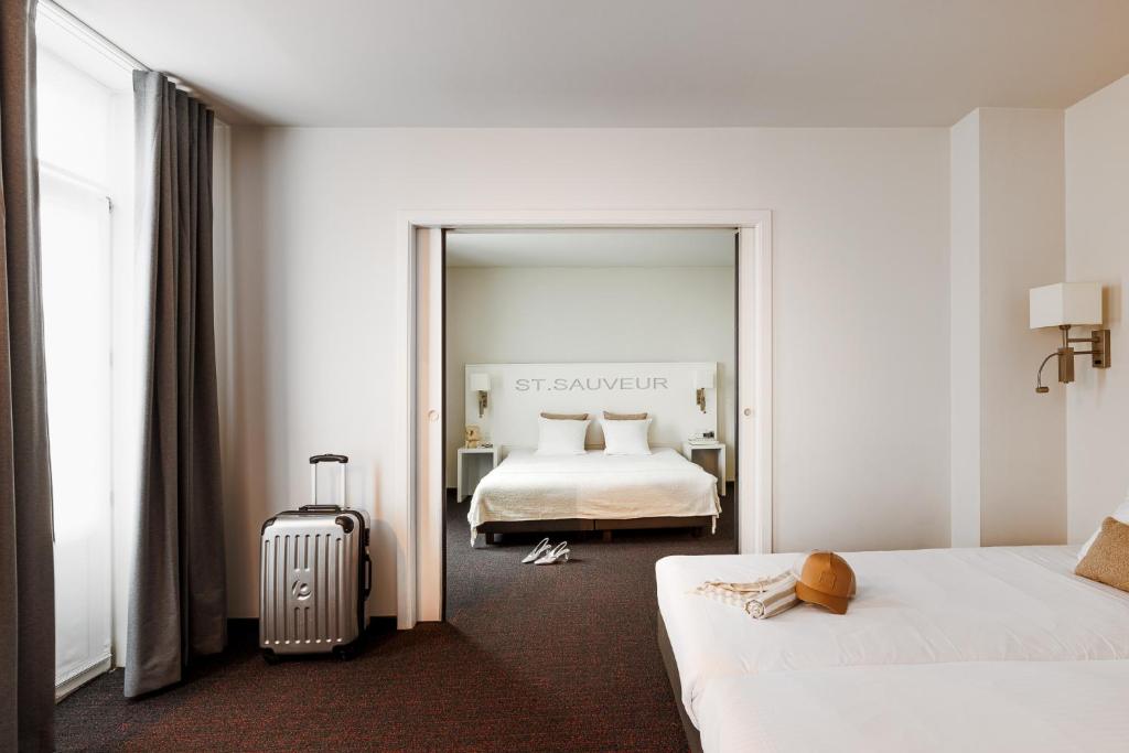 Postel nebo postele na pokoji v ubytování Hotel Saint Sauveur by WP Hotels