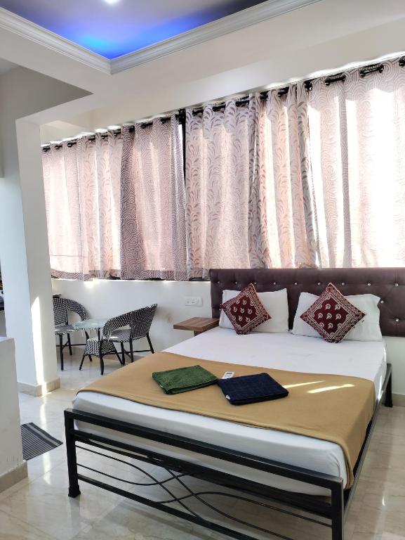 Postel nebo postele na pokoji v ubytování Hotel Big House Inn