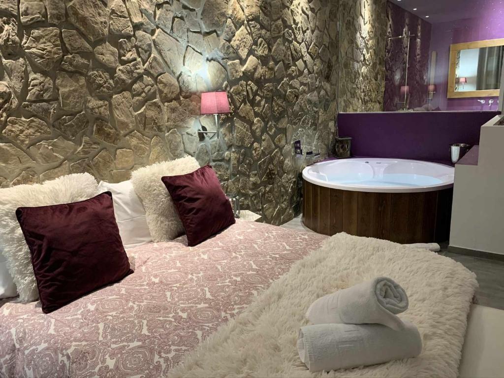 a bathroom with a bed and a bath tub at Loft mora - benaocaz in Benaocaz