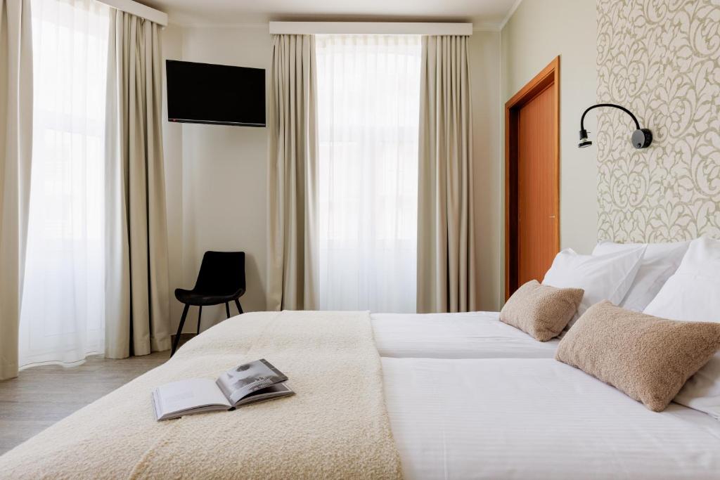 Postel nebo postele na pokoji v ubytování Hotel Corner House by WP Hotels