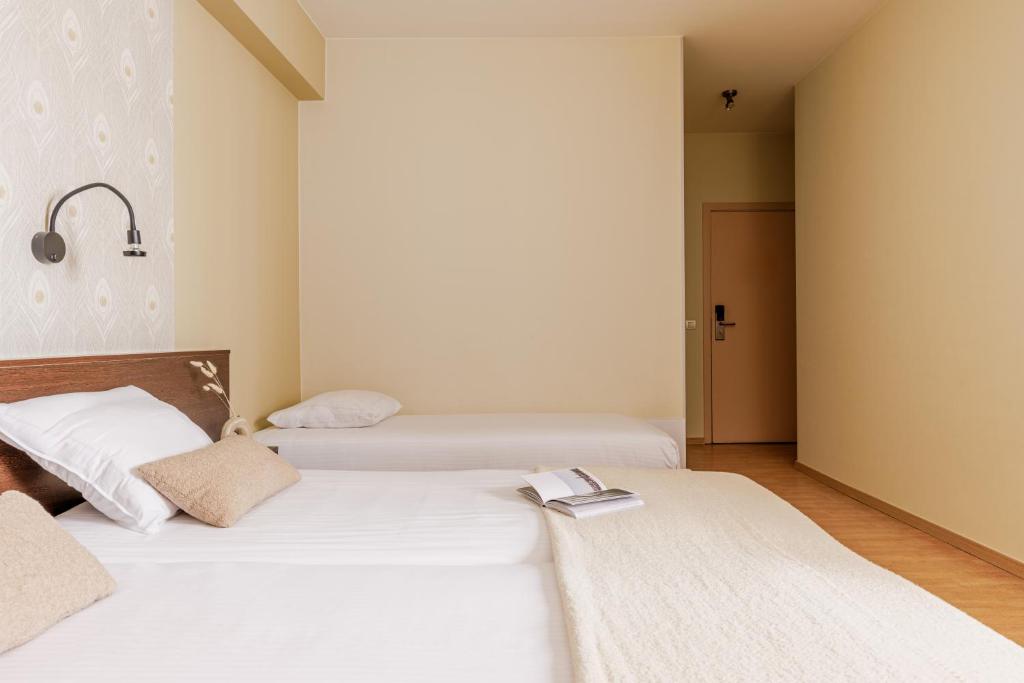 Postel nebo postele na pokoji v ubytování Hotel Corner House by WP Hotels