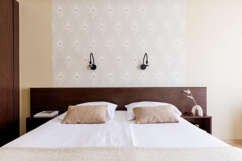 Postel nebo postele na pokoji v ubytování Hotel Corner House by WP Hotels