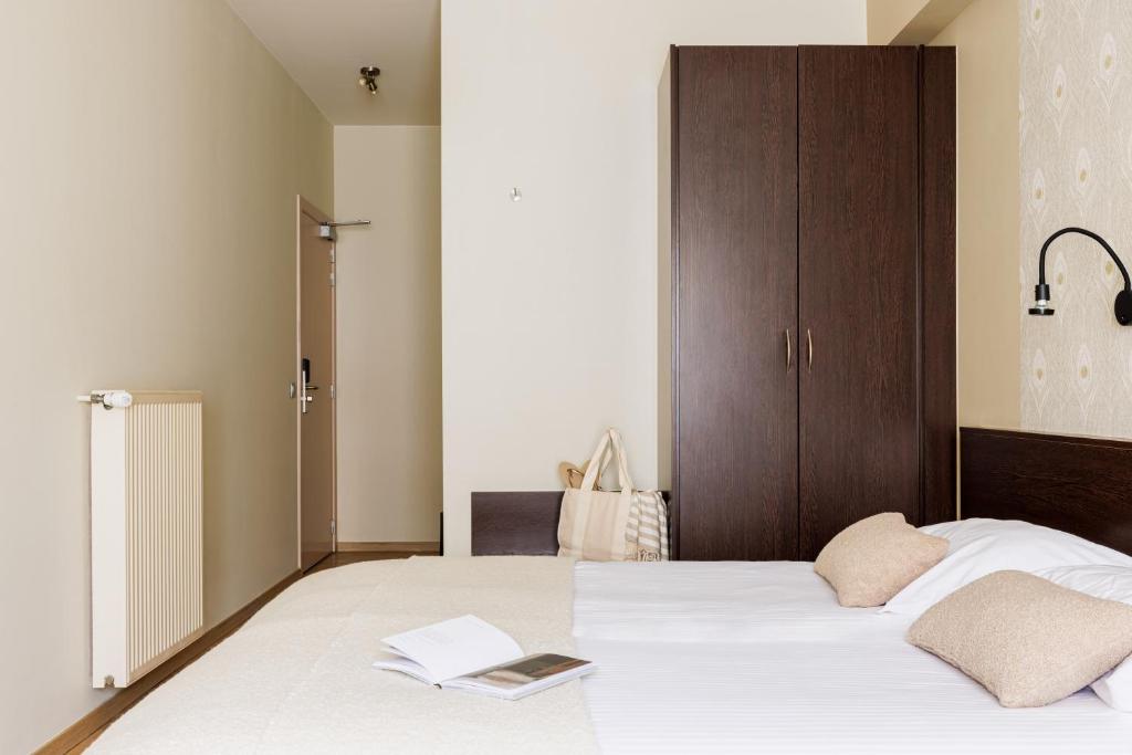 Postel nebo postele na pokoji v ubytování Hotel Corner House by WP Hotels