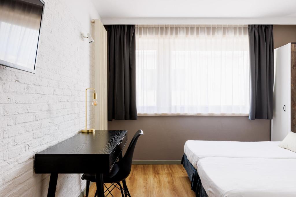 Postel nebo postele na pokoji v ubytování Hotel Cavalli by WP Hotels