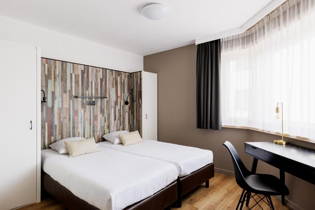 Postel nebo postele na pokoji v ubytování Hotel Cavalli by WP Hotels