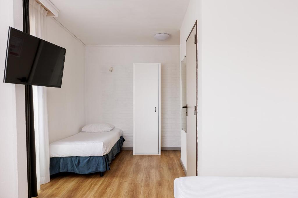 Postel nebo postele na pokoji v ubytování Hotel Cavalli by WP Hotels