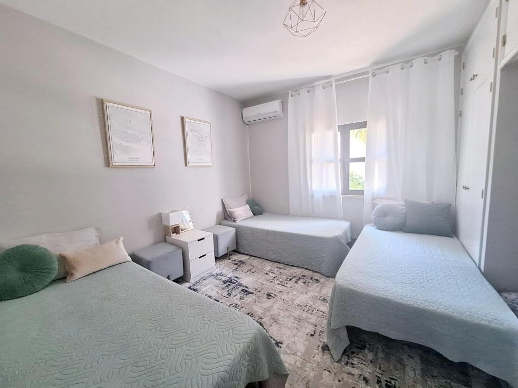 Postel nebo postele na pokoji v ubytování Feliz Algarve