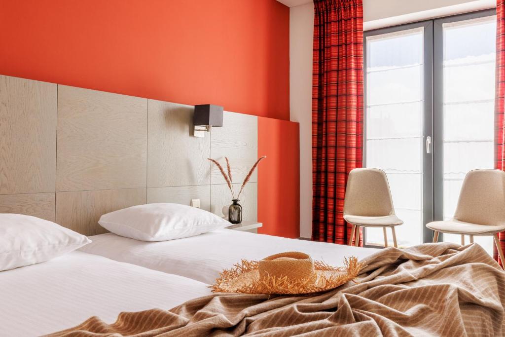 Postel nebo postele na pokoji v ubytování Enjoy Hotel Blankenberge - Pantheon Palace By WP Hotels