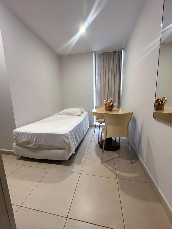 Postel nebo postele na pokoji v ubytování Sumatra Hotel e Centro de Convenções