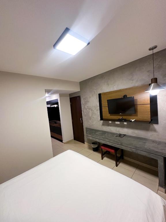 Postel nebo postele na pokoji v ubytování Sumatra Hotel e Centro de Convenções