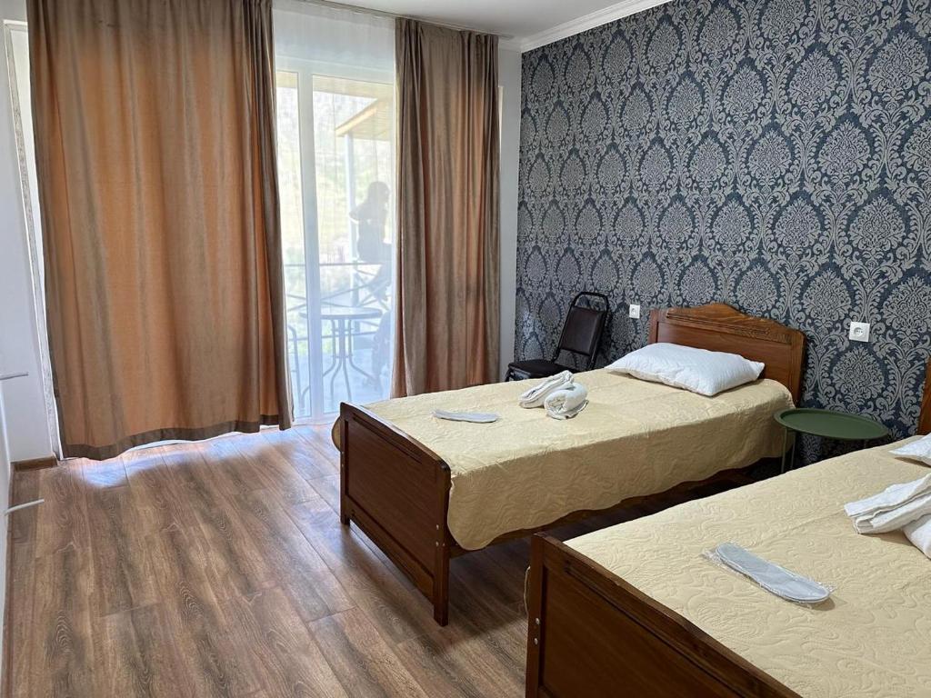 Postel nebo postele na pokoji v ubytování Hotel-GVALA