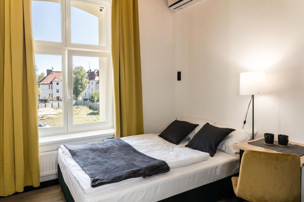 Ένα ή περισσότερα κρεβάτια σε δωμάτιο στο Tumski Apartments FREE PARKING self check-in 24h