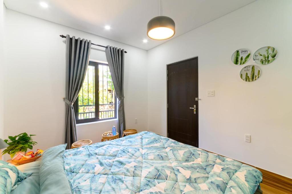 Postel nebo postele na pokoji v ubytování Kivi Homestay Hoi An