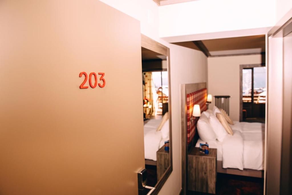 Postel nebo postele na pokoji v ubytování Hotel Bristol Verbier
