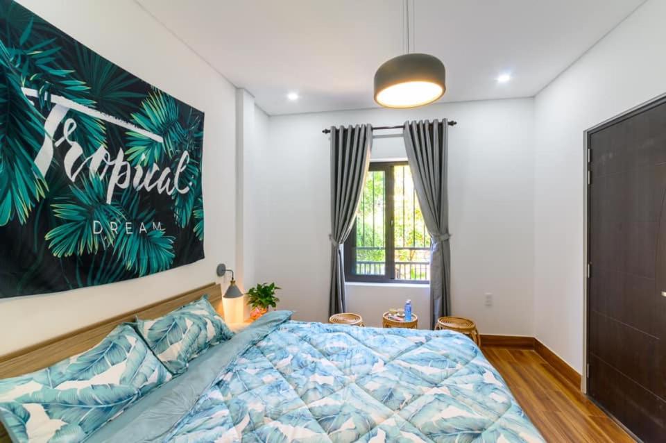 Postel nebo postele na pokoji v ubytování Kivi Homestay Hoi An
